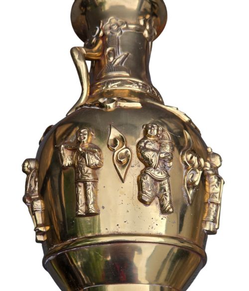 fig 6. A late 19th-century Chinese brass baluster vase featuring raised high-relief carvings of Daoist figures, clouds, and floral handles.