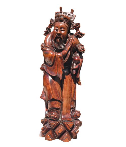 fig 4. A pair of Chinese hardwood sculptures depicting Daoist immortals in flowing robes with carved geometric bases.