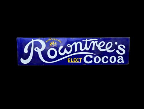 fig 2. A rectangular cobalt blue vitreous enamel advertising sign featuring white script reading Rowntrees Cocoa and yellow lettering reading Elect Cocoa, topped with a royal warrant crest.