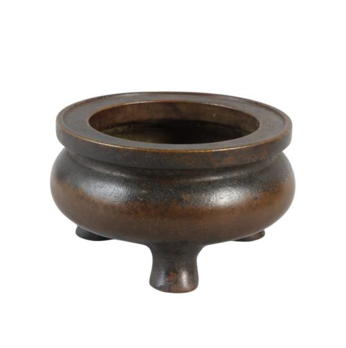 fig 2. A heavy 17th-century Chinese archaistic bronze tripod censer featuring a compressed globular body, wide flat rim, dark brown patina, and three sturdy feet.