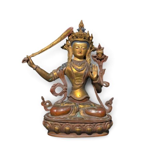 fig 1. An antique Sino-Tibetan gilt-bronze figure of Bodhisattva Manjushri seated cross-legged on a double-lotus base, brandishing a flaming sword in his right hand.