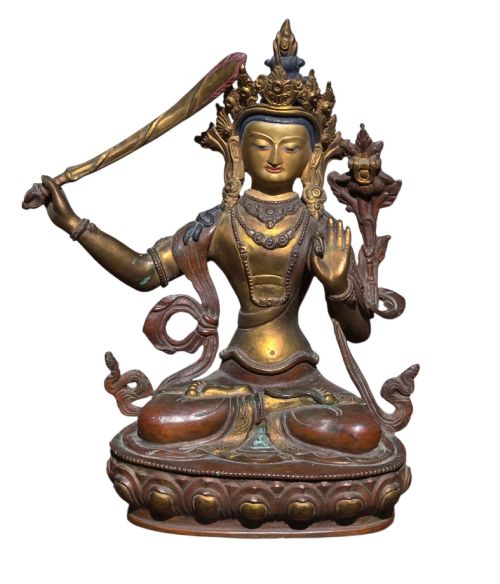 fig 2. An antique Sino-Tibetan gilt-bronze figure of Bodhisattva Manjushri seated cross-legged on a double-lotus base, brandishing a flaming sword in his right hand.