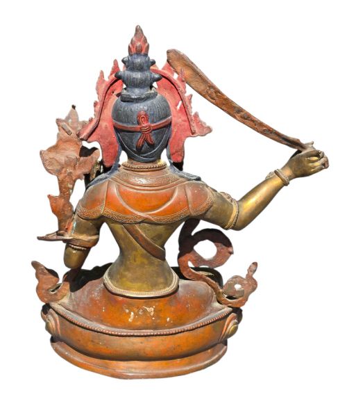 fig 6. An antique Sino-Tibetan gilt-bronze figure of Bodhisattva Manjushri seated cross-legged on a double-lotus base, brandishing a flaming sword in his right hand.