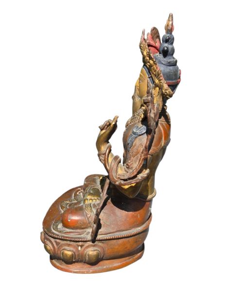 fig 7. An antique Sino-Tibetan gilt-bronze figure of Bodhisattva Manjushri seated cross-legged on a double-lotus base, brandishing a flaming sword in his right hand.