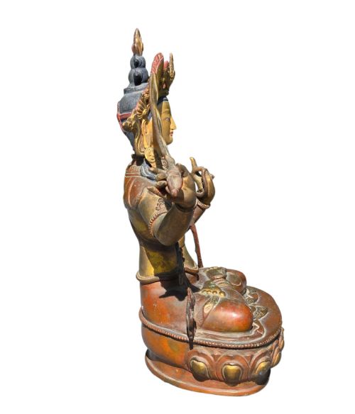 fig 8. An antique Sino-Tibetan gilt-bronze figure of Bodhisattva Manjushri seated cross-legged on a double-lotus base, brandishing a flaming sword in his right hand.