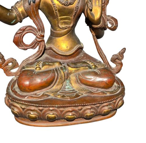 fig 9. An antique Sino-Tibetan gilt-bronze figure of Bodhisattva Manjushri seated cross-legged on a double-lotus base, brandishing a flaming sword in his right hand.