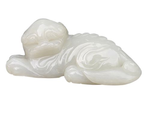 A Fine Chinese White Jade Carving of a Recumbent Mythical Beast  Late 18th/early 19th Century