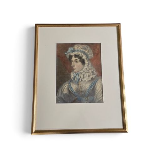 fig 1. A framed 19th-century watercolour portrait depicting a lady wearing a lace bonnet trimmed with blue ribbons.