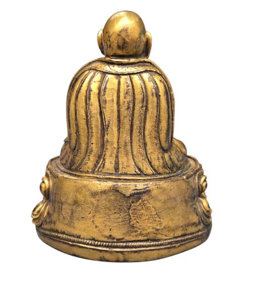 fig 3. An 18th-century gilt-bronze miniature figure of Lama Shang seated cross-legged on a double-lotus pedestal in patterned robes.