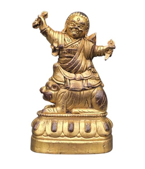 A Fine Sino-tibetan Gilt-bronze Votive Figure of a Wrathful Buddhist Protector Deity Seated on a Tiger ​Sixteenth to Seventeenth Century