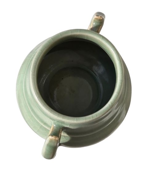 fig 1. A celadon green crackle-glazed ceramic incense burner with two loop handles and raised horizontal bands.
