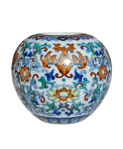 fig 1. A rounded Chinese porcelain water pot decorated in doucai enamels with lotus flowers, bats, and scrolling foliage.