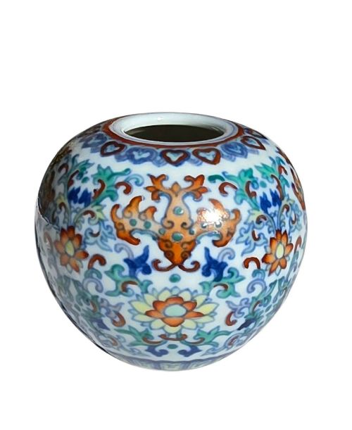 fig 7. A rounded Chinese porcelain water pot decorated in doucai enamels with lotus flowers, bats, and scrolling foliage.