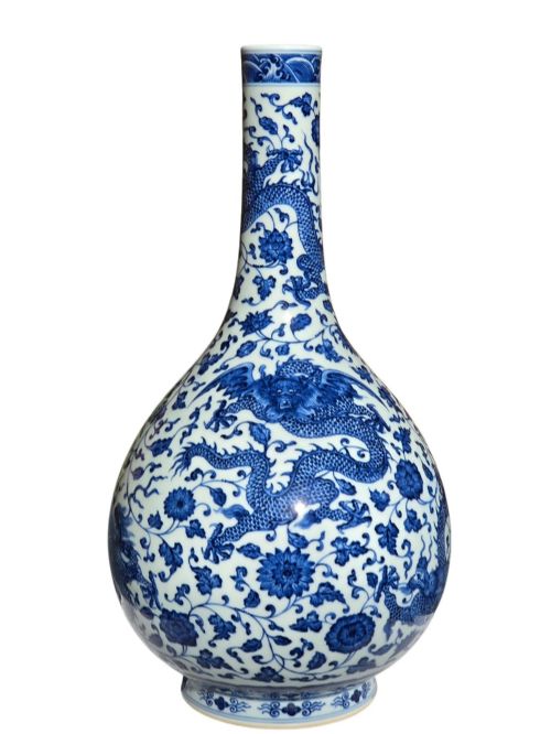 fig 4. A pear-shaped Chinese porcelain bottle vase decorated with detailed underglaze cobalt blue five-clawed dragons amidst floral scrolls.