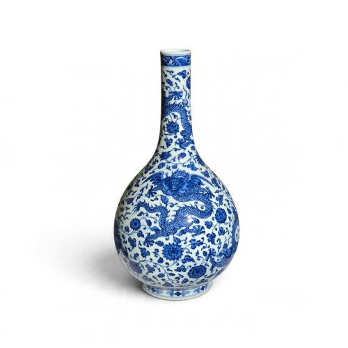 fig 1. A pear-shaped Chinese porcelain bottle vase decorated with detailed underglaze cobalt blue five-clawed dragons amidst floral scrolls.