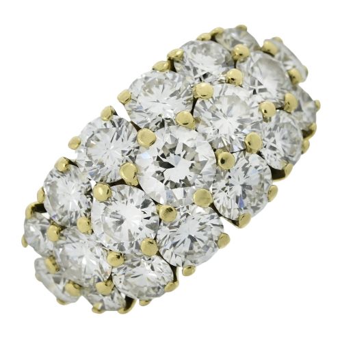 fig 1. An 18ct yellow gold dome cluster ring closely set with multiple round brilliant cut diamonds in claw settings.