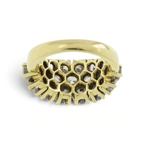 fig 4. An 18ct yellow gold dome cluster ring closely set with multiple round brilliant cut diamonds in claw settings.