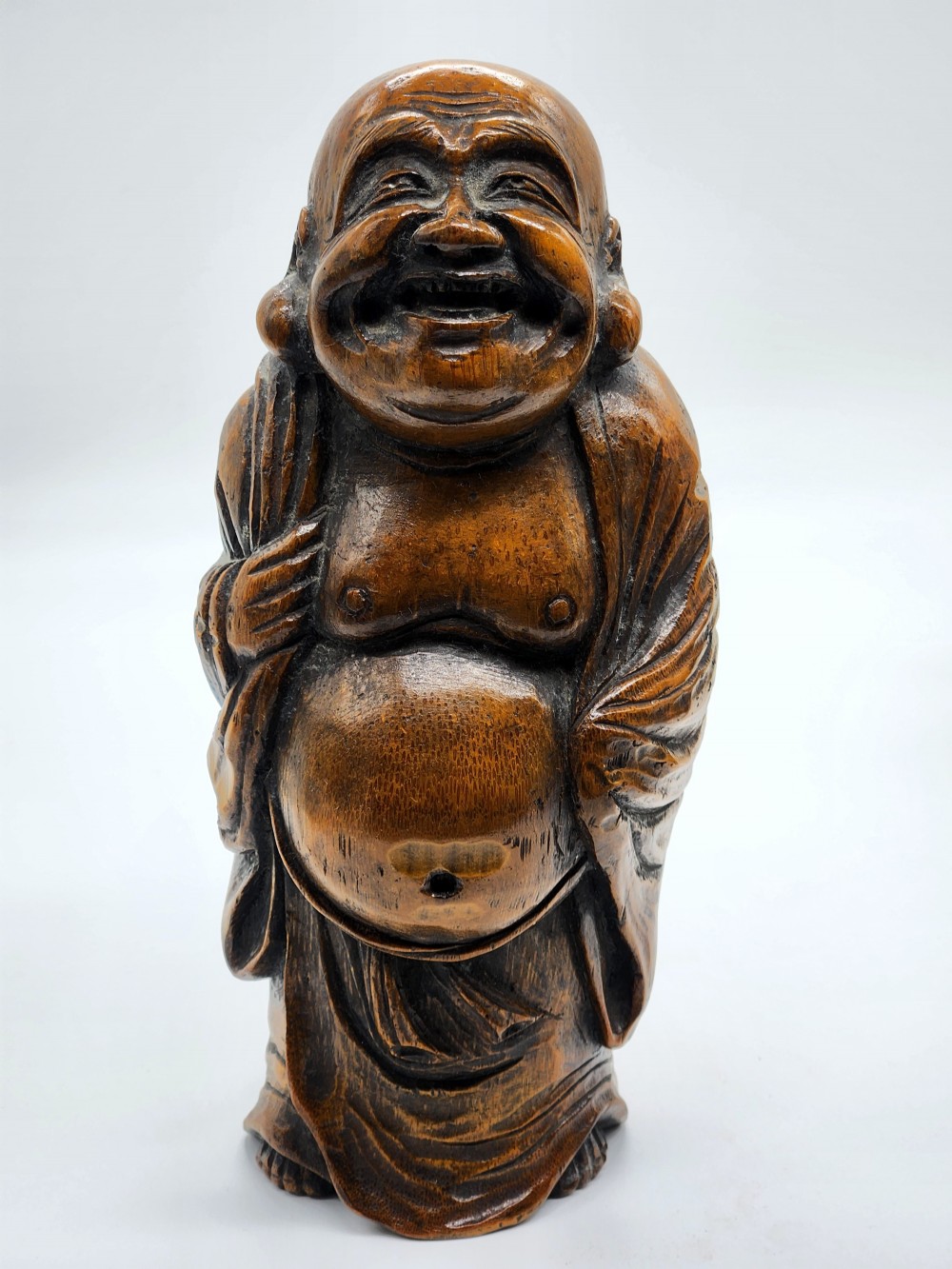 A Japanese Carved Wood Sculpture of Hotei Laughing Buddha