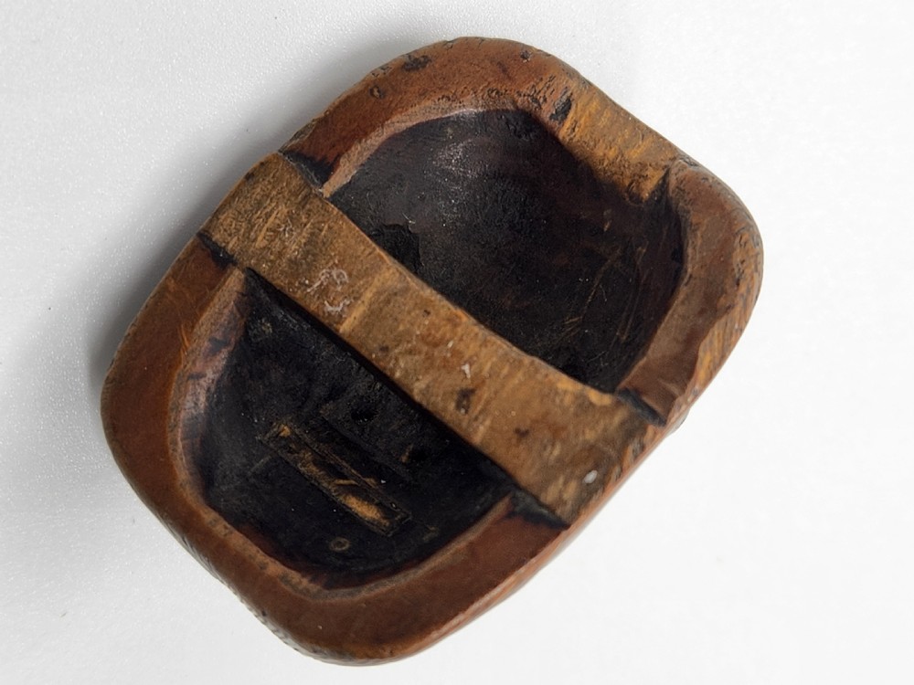 AN AMUSING WOOD MASK NETSUKE OF A LONG-NOSED TENGU EDO PERIOD View III