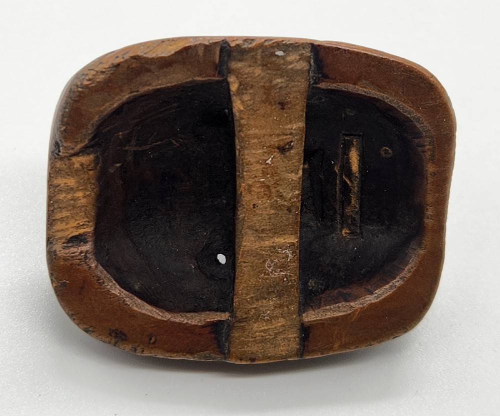 AN AMUSING WOOD MASK NETSUKE OF A LONG-NOSED TENGU EDO PERIOD View IV