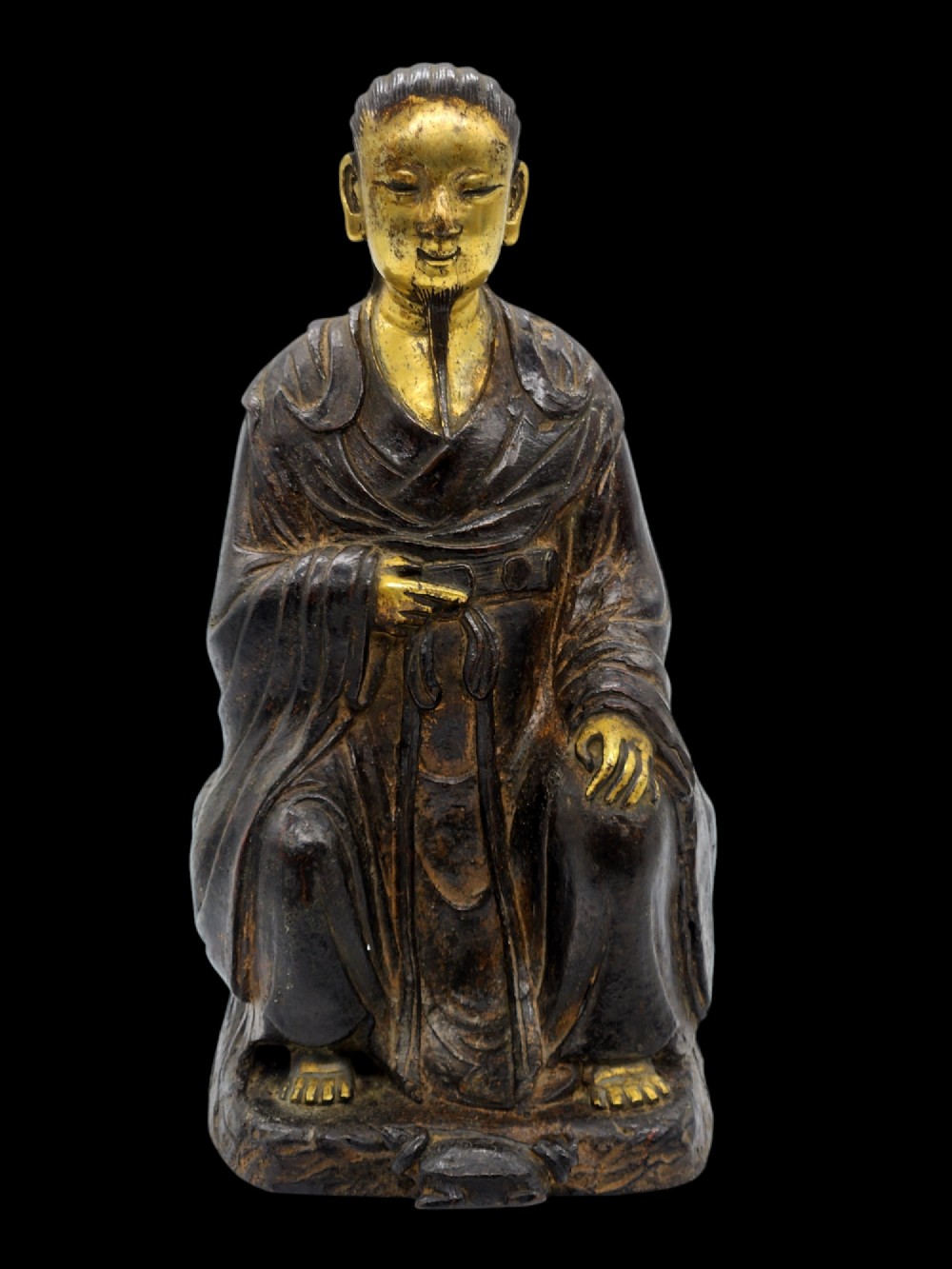 A RARE CHINESE MING DYNASTY PARCEL-GILT BRONZE FIGURE OF ZHENWU