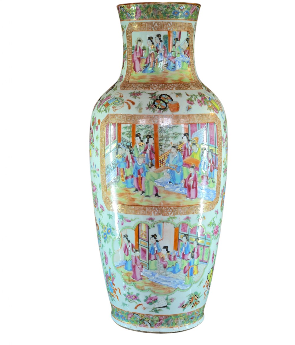 A 19th-century Cantonese Rose Mandarin porcelain baluster vase decorated with narrative figure panels, floral enamel borders, and a domed cover topped with a gilt foo dog finial. View XI