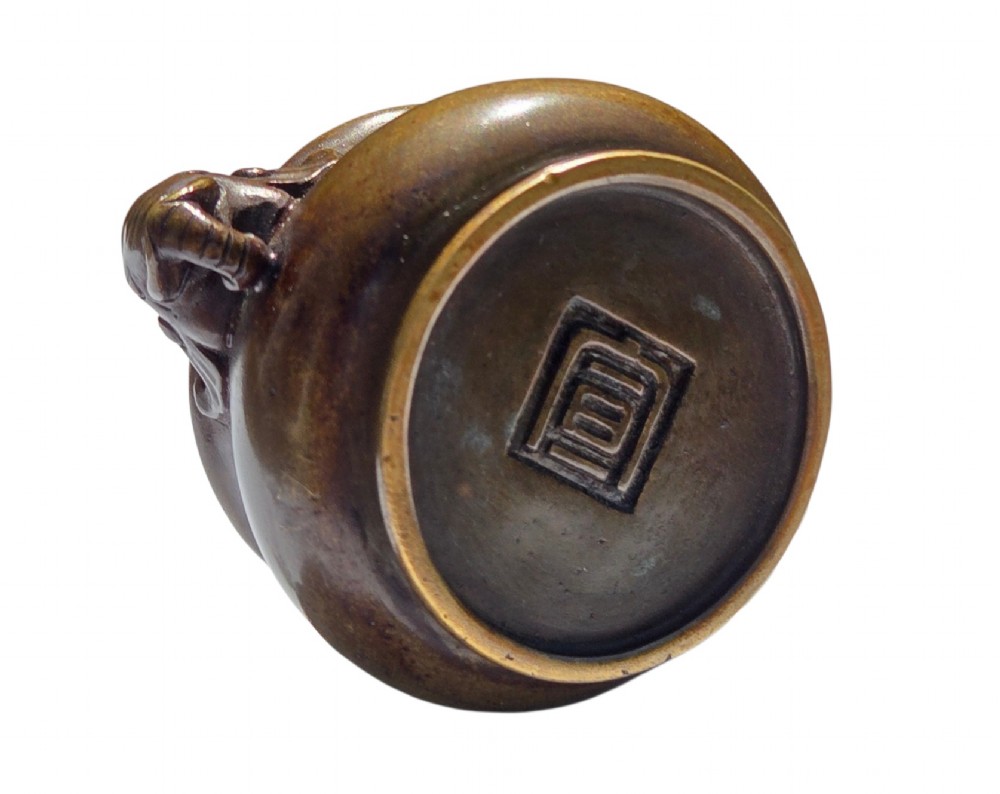 A miniature dark bronze censer featuring a rounded body, twin elephant head handles with curved trunks, and a circular raised footring. View IV