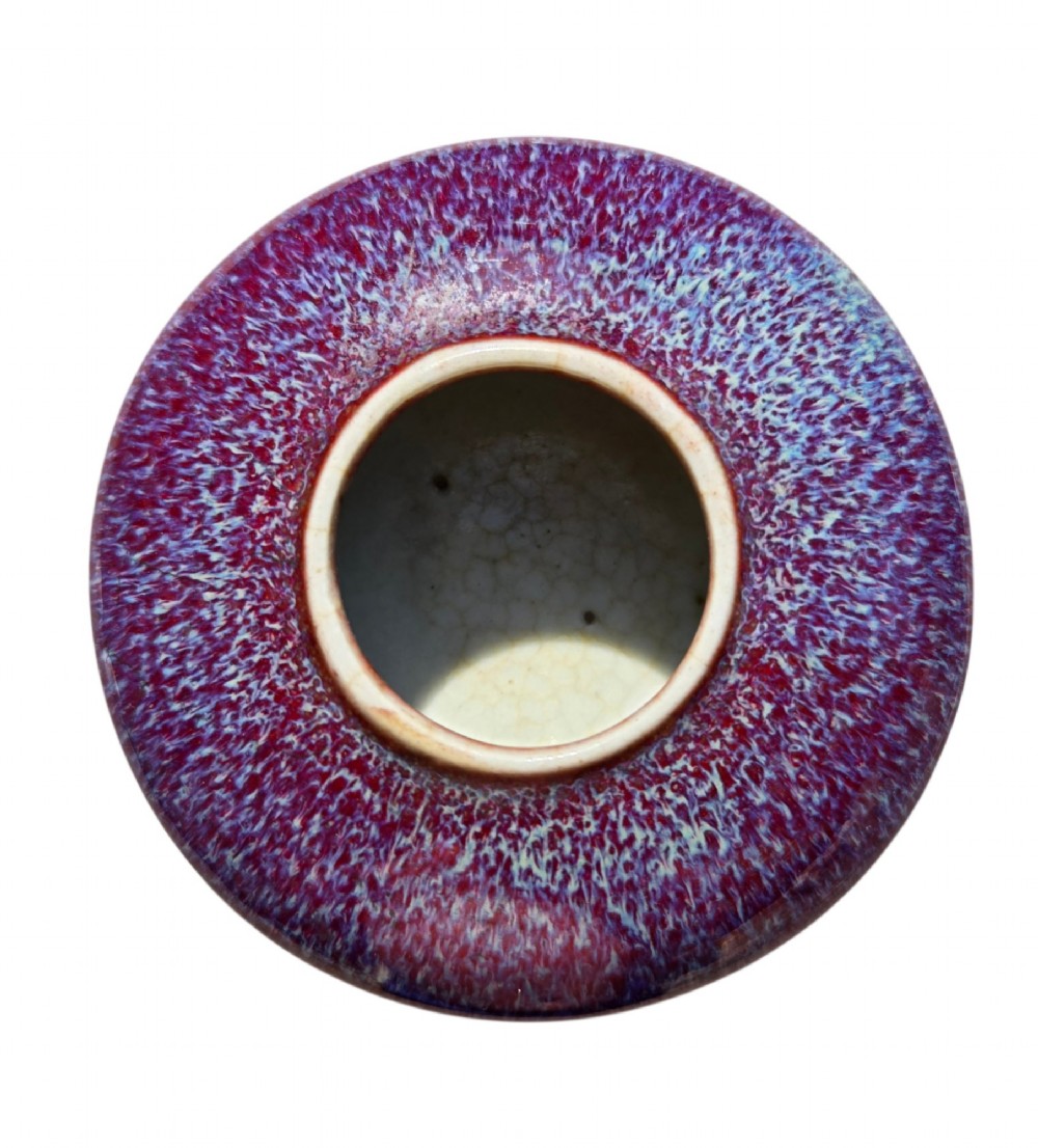 A compressed circular Chinese porcelain brush washer featuring a mottled purple and lavender blue flambe glaze. View VII