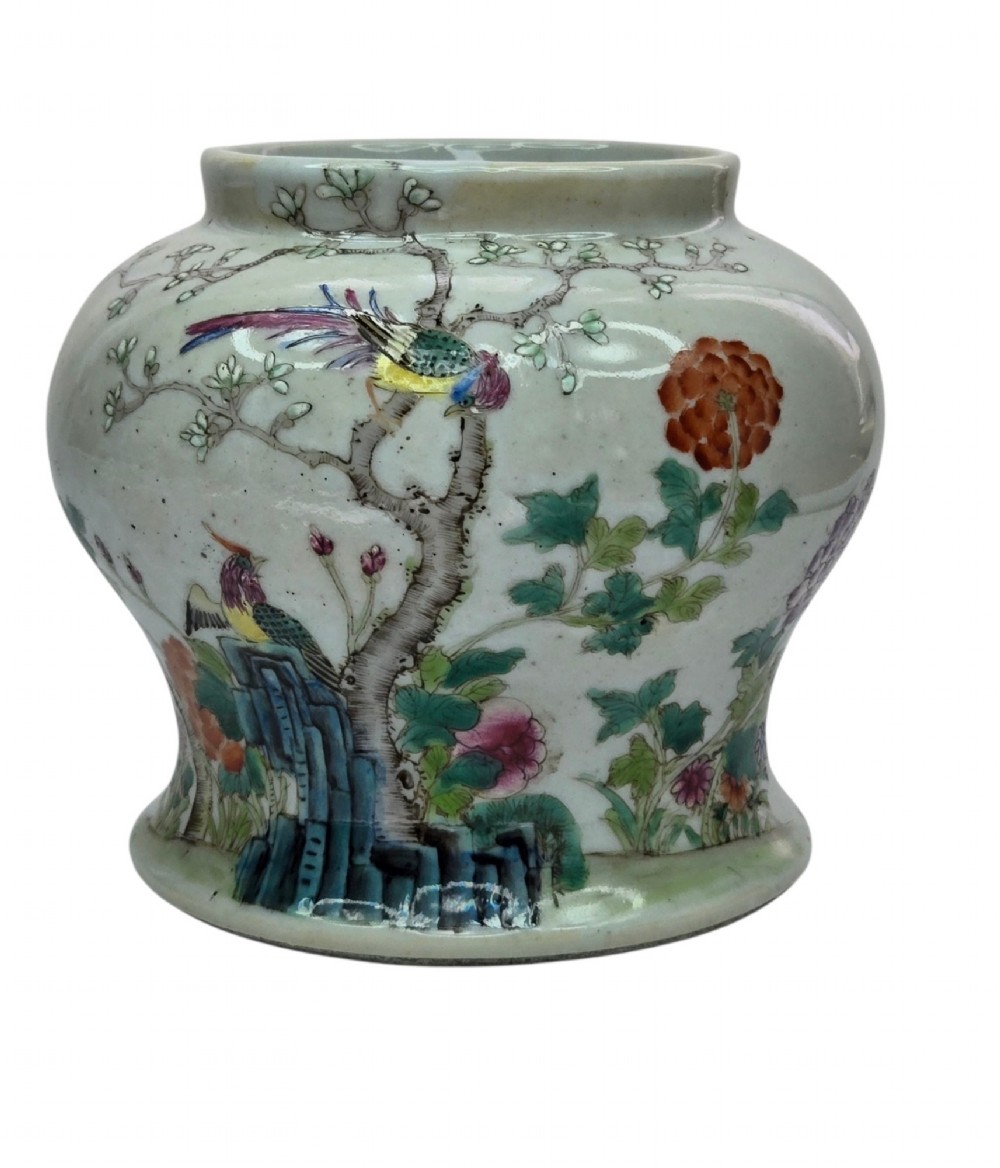 A Chinese Famille Rose porcelain jar decorated with hand-painted birds, flowers, and rockwork against a white ground. View III