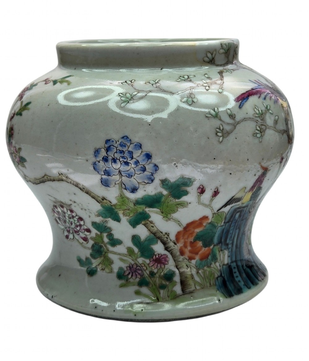 A Chinese Famille Rose porcelain jar decorated with hand-painted birds, flowers, and rockwork against a white ground. View IV