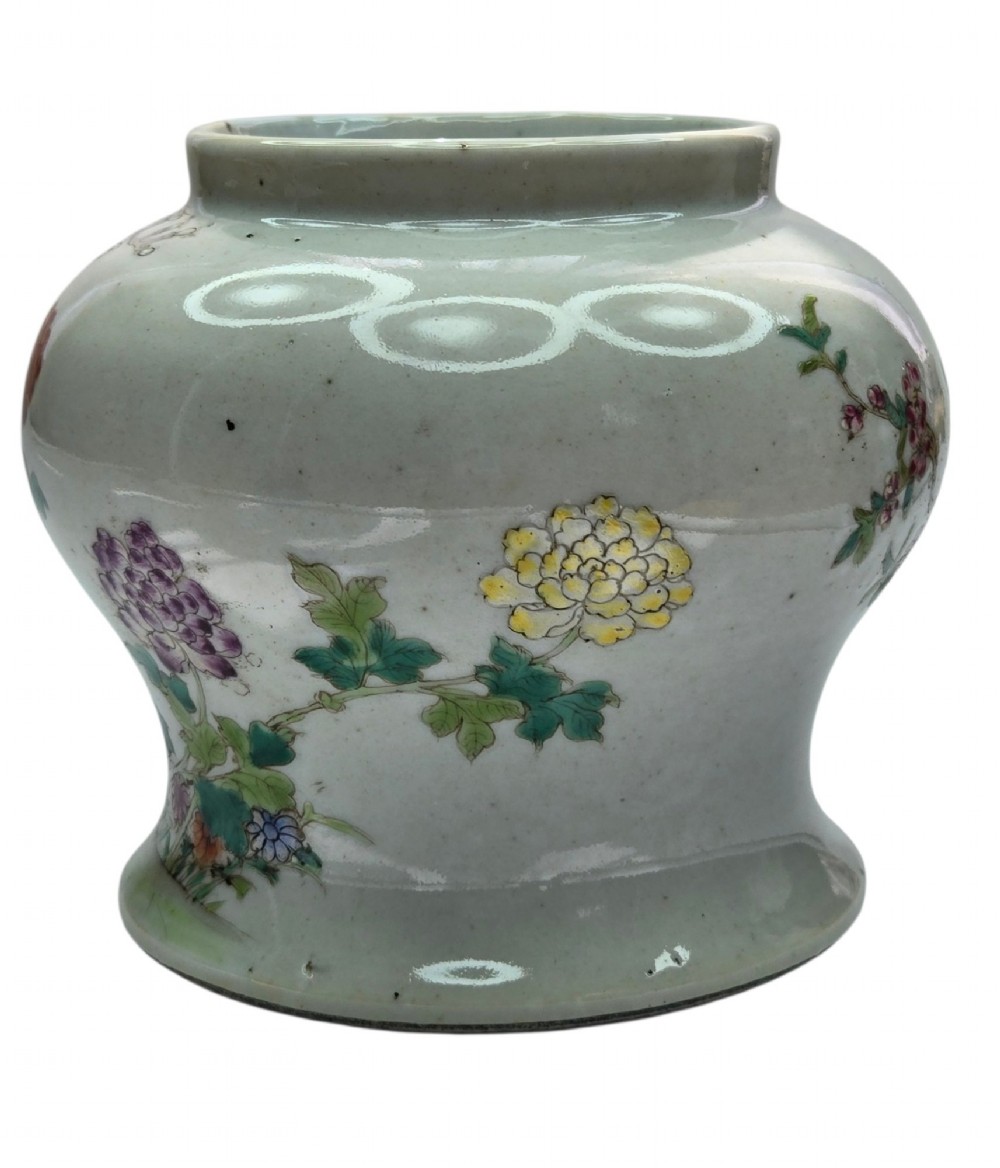 A Chinese Famille Rose porcelain jar decorated with hand-painted birds, flowers, and rockwork against a white ground. View VI