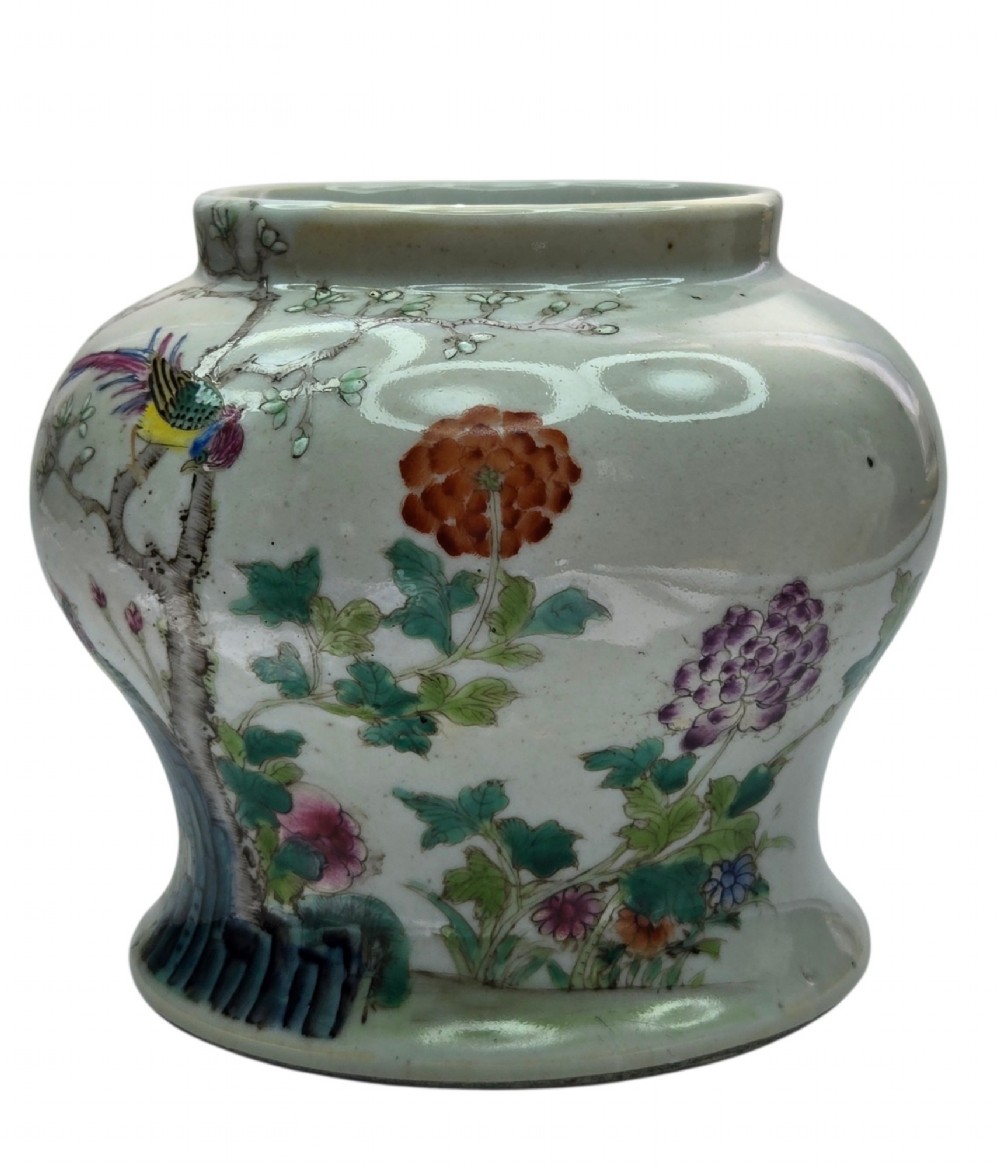 A Chinese Famille Rose porcelain jar decorated with hand-painted birds, flowers, and rockwork against a white ground. View VII