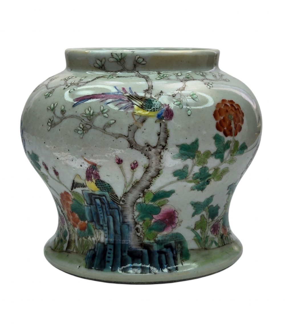 A Chinese Famille Rose porcelain jar decorated with hand-painted birds, flowers, and rockwork against a white ground. View VIII