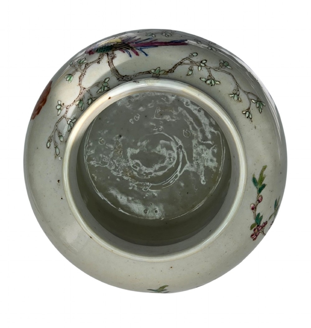 A Chinese Famille Rose porcelain jar decorated with hand-painted birds, flowers, and rockwork against a white ground. View IX