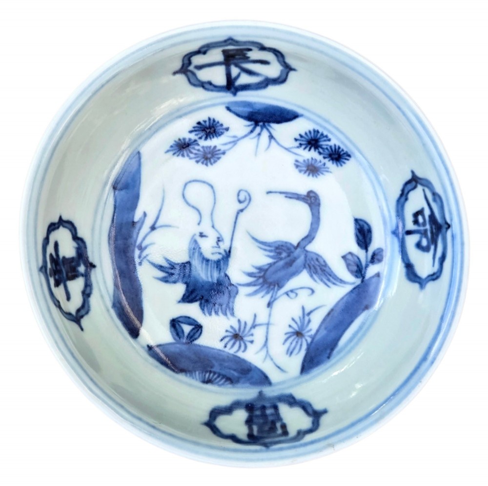 A circular Chinese blue and white porcelain deep saucer dish decorated with cobalt underglaze imagery of Shoulao, a crane, and character cartouches. View XIII