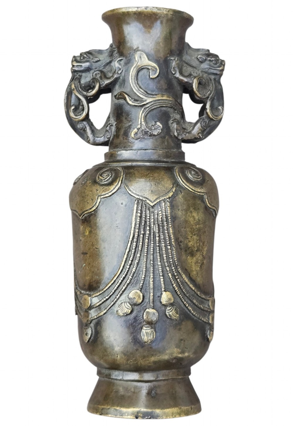 A patinated cast bronze Chinese vase featuring stylised dragon-head handles and raised Yingluo beaded tassels. View VIII