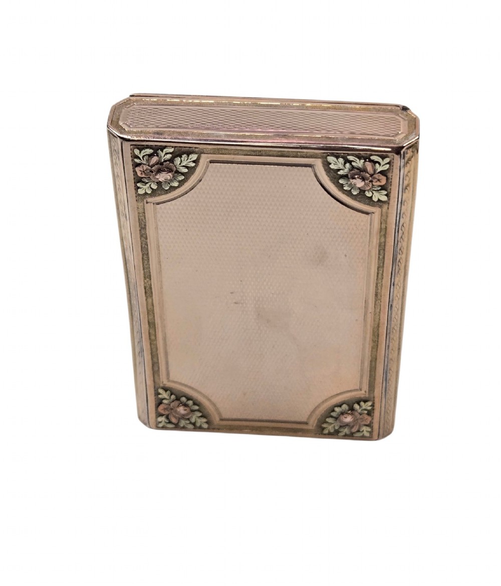A rectangular 18K gold snuff box featuring engine-turned panels and chased floral relief borders in multi-toned gold. View IX