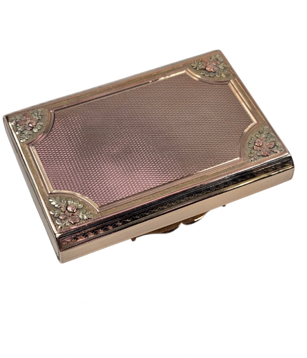 A rectangular 18K gold snuff box featuring engine-turned panels and chased floral relief borders in multi-toned gold. View XV