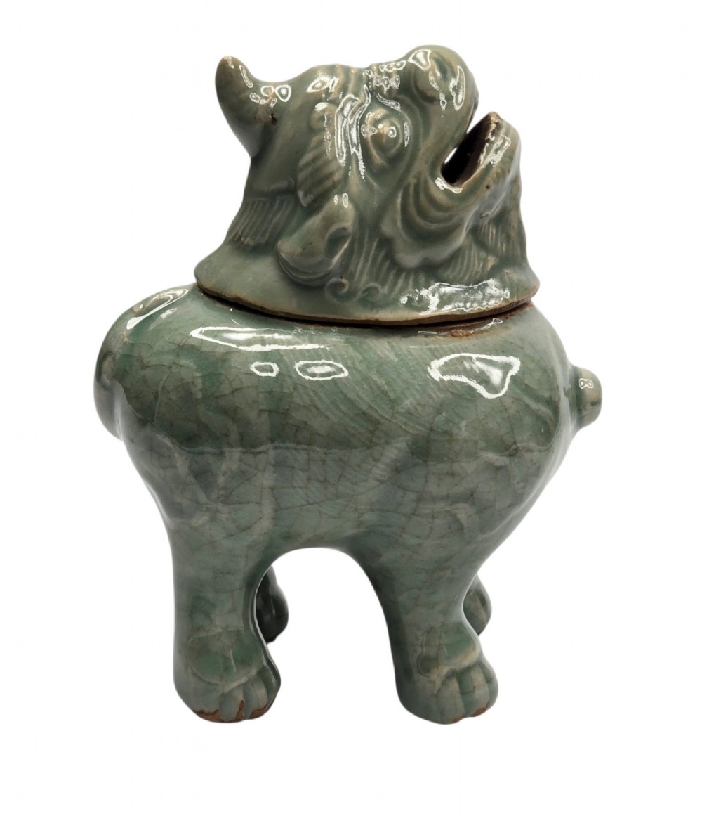 A celadon-glazed ceramic incense burner formed as a quadruped mythical creature with a removable head serving as the lid. View II