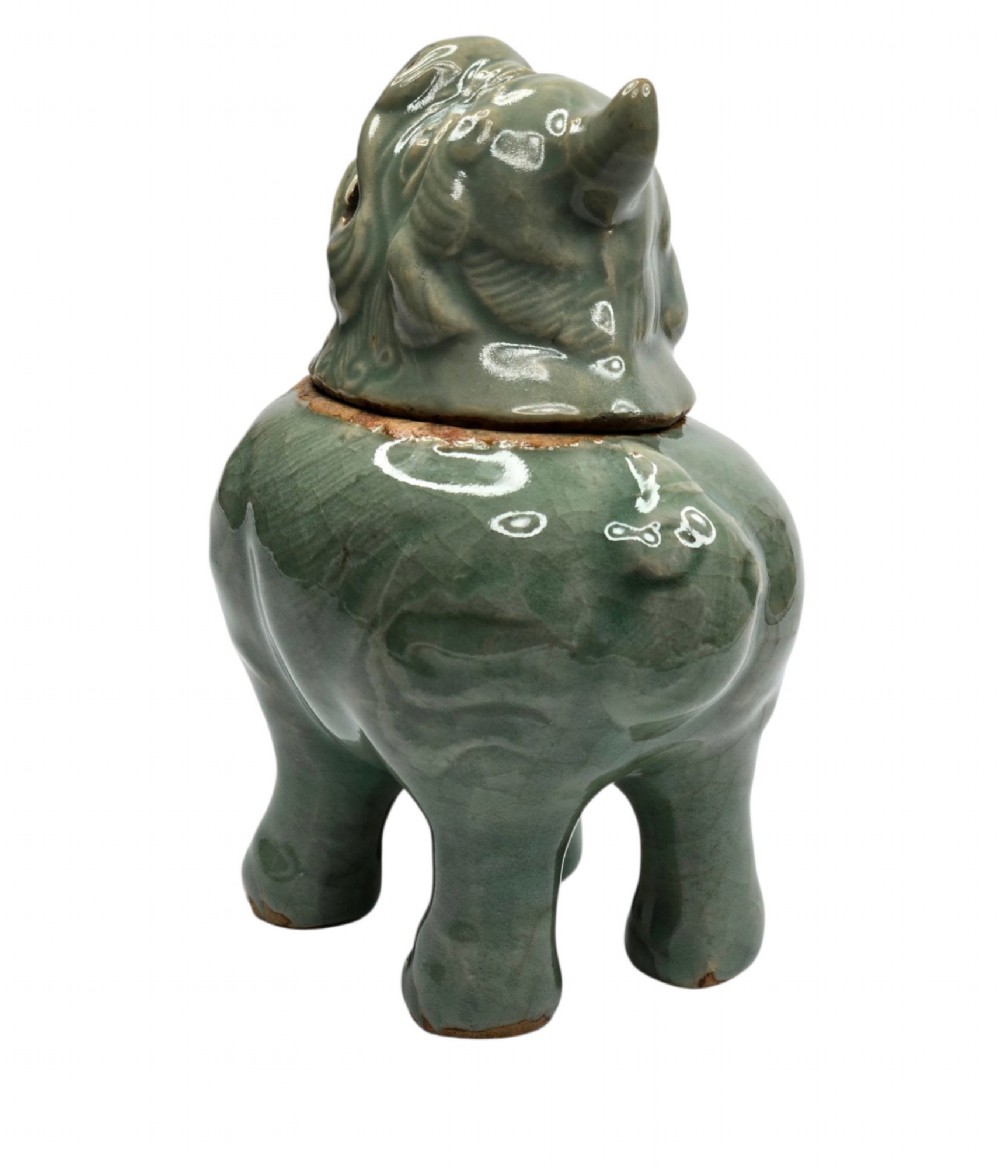 A celadon-glazed ceramic incense burner formed as a quadruped mythical creature with a removable head serving as the lid. View V