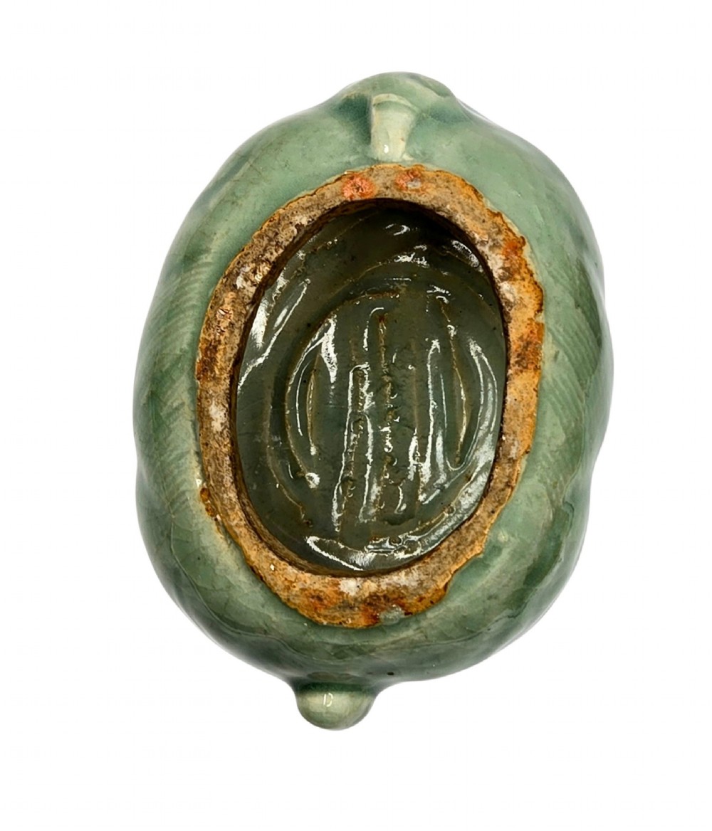 A celadon-glazed ceramic incense burner formed as a quadruped mythical creature with a removable head serving as the lid. View VIII