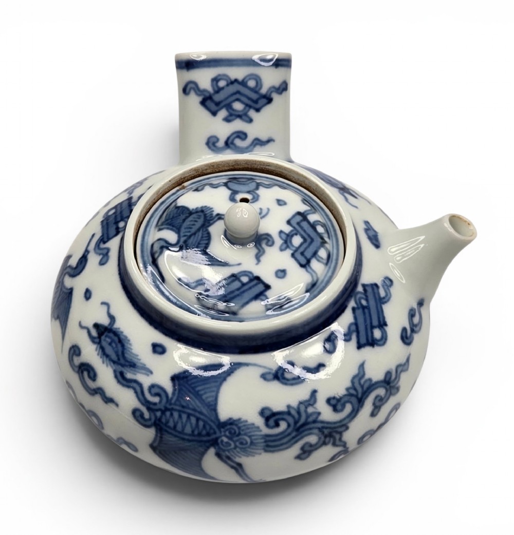 A Japanese porcelain side-handled teapot featuring hand-painted cobalt blue motifs against a white background. View II