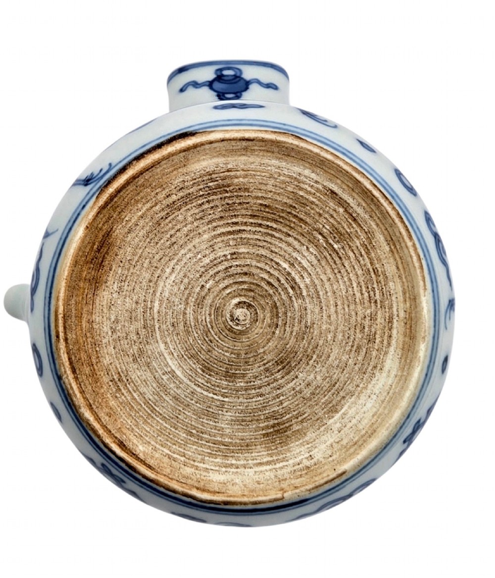 A Japanese porcelain side-handled teapot featuring hand-painted cobalt blue motifs against a white background. View IX