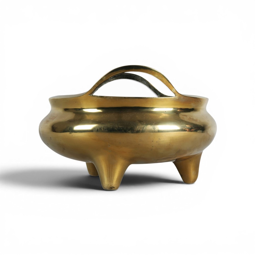 A heavy gold-toned cast bronze tripod censer featuring two upright loop handles and conical feet. View VII