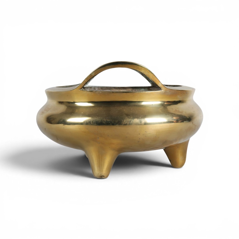 A heavy gold-toned cast bronze tripod censer featuring two upright loop handles and conical feet. View VIII