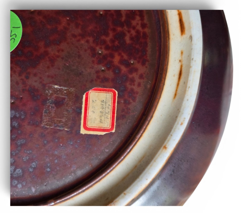 A low compressed circular ceramic brush washer featuring a dark reddish-brown iron rust glaze with subtle metallic speckling. View III