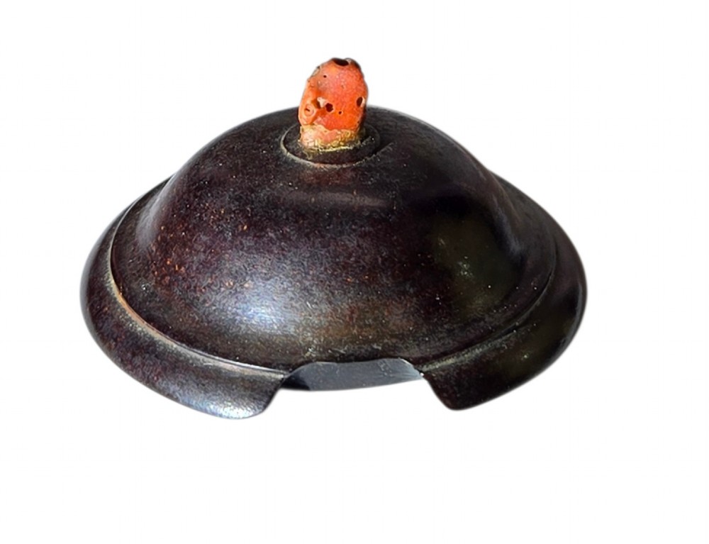A miniature pale celadon green tripod censer with a distinct crackle glaze, fitted with a dark wood cover and a carved red coral finial. View XII