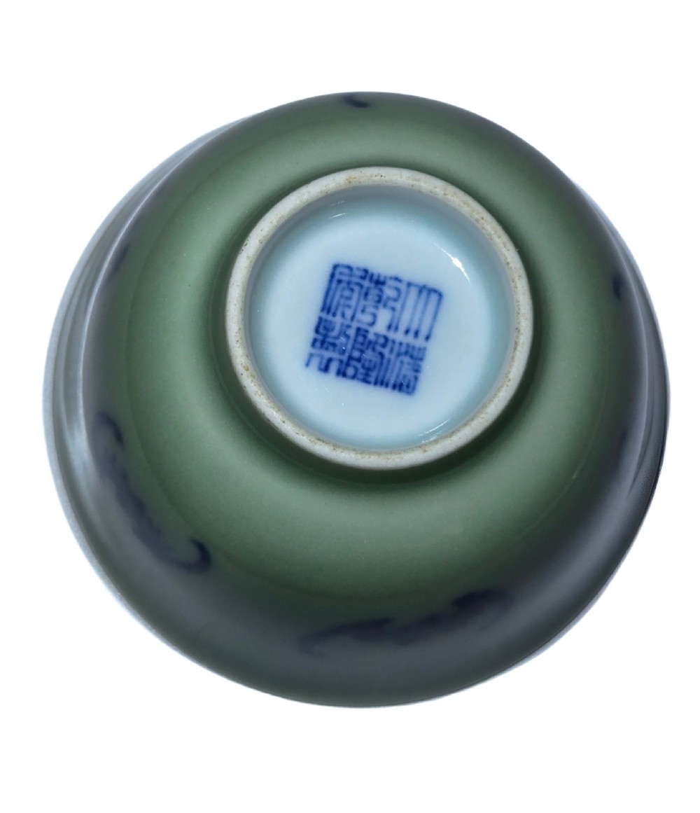 A small Chinese celadon green glazed porcelain cup decorated with underglaze blue bat motifs around the exterior. View XI