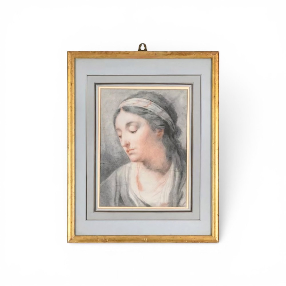 A chalk portrait drawing depicting the head and shoulders of a young woman wearing a patterned headband with her head tilted downwards. View VI