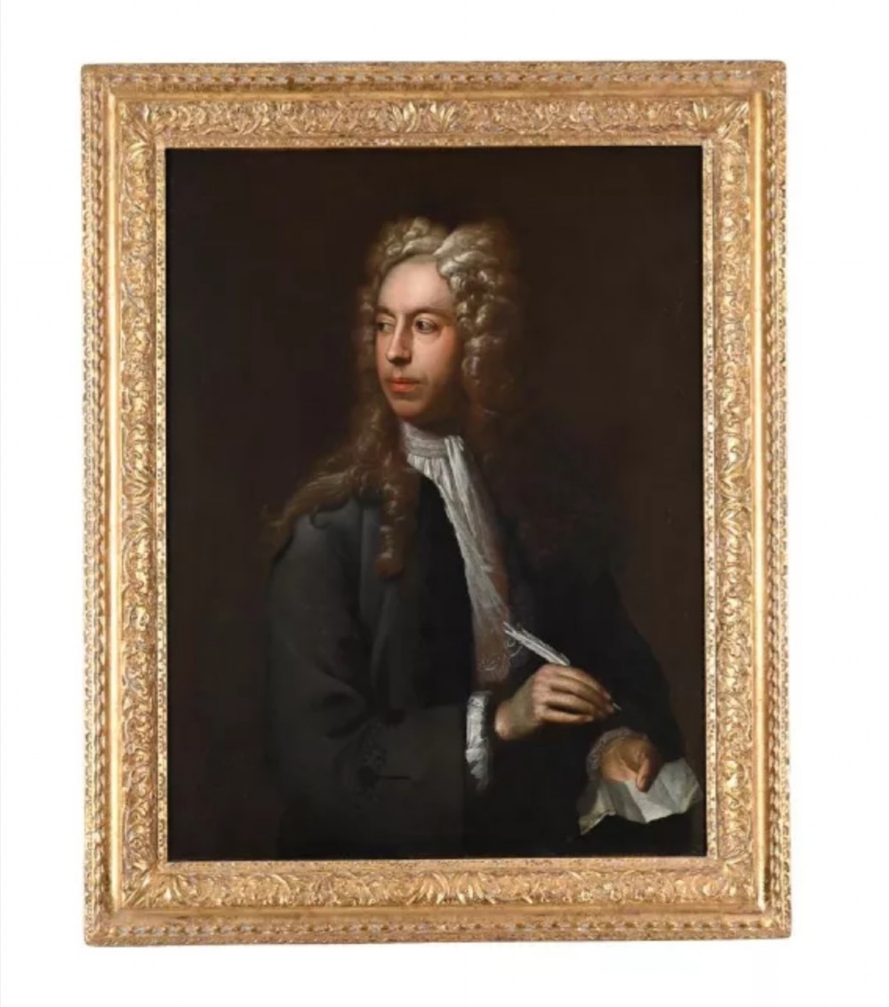 An eighteenth-century oil painting depicting a gentleman scholar with a long wig and quill pen, set within an ornate gilded frame. View V